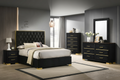 Chloe black velvet platform bed with gold accent frame and button-tufted headboard