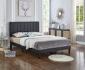Delisle black faux-leather adjustable bed with vertical tufting
